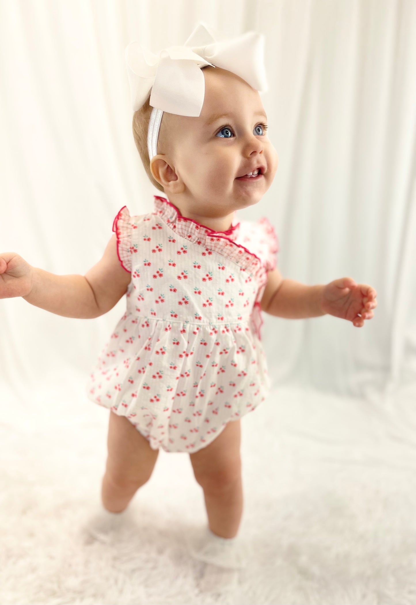 Deolinda coral floral bow romper